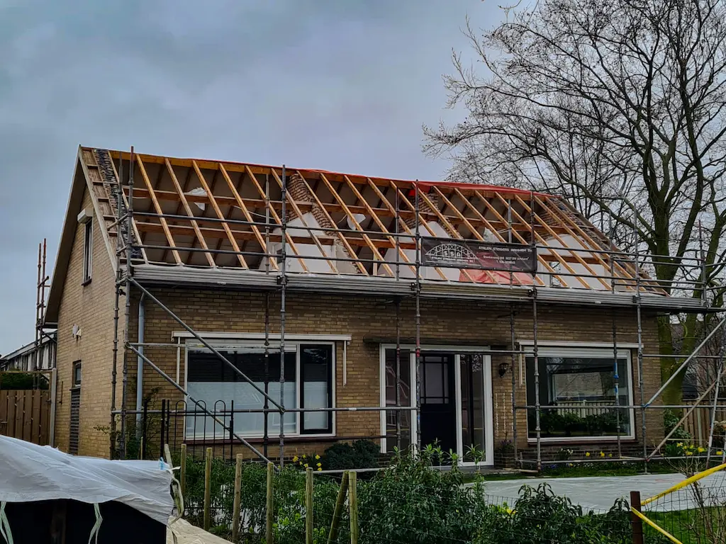 Left front view of the remediated dwelling house. Roof boarding removed.